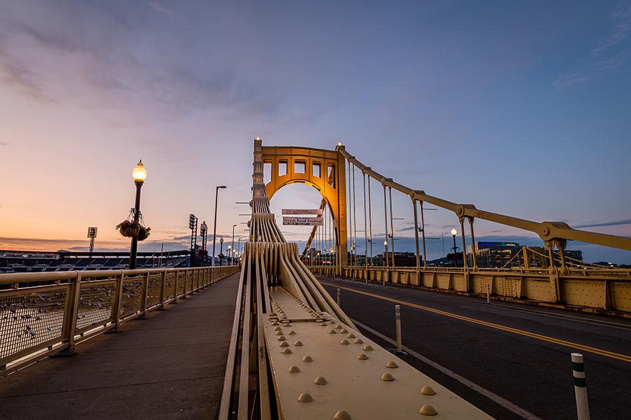 Pittsburgh, PA Insurance - Yellow Steel Bridge in Pittsburgh, Pennsylvania at Dusk
